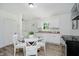 Eat-in kitchen with stainless steel appliances and white cabinets, plus the laundry visible at 3709 Central Ave, Indianapolis, IN 46205