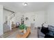 Open living room featuring a staircase, views to other rooms, and neutral decor at 3709 Central Ave, Indianapolis, IN 46205
