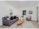 Bright living room featuring stylish furniture, light wood flooring, and neutral decor at 3709 Central Ave, Indianapolis, IN 46205