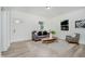 Bright living room featuring stylish furniture, light wood flooring, and neutral decor at 3709 Central Ave, Indianapolis, IN 46205