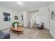 Open living room featuring a staircase, views to other rooms, and neutral decor at 3709 Central Ave, Indianapolis, IN 46205