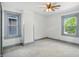 Bright bedroom with fresh white paint, light grey trim, and a ceiling fan at 39 N Bosart N Ave, Indianapolis, IN 46201