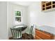 Bright breakfast nook with a window, seating for two, and storage at 39 N Bosart N Ave, Indianapolis, IN 46201