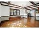 Elegant dining room with hardwood floors, decorative trim, built-in bench, and fireplace view at 39 N Bosart N Ave, Indianapolis, IN 46201