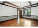 Dining room with hardwood floors, decorative trim, chandelier, and natural light at 39 N Bosart N Ave, Indianapolis, IN 46201