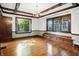 Elegant dining room with hardwood floors, decorative trim, built-in bench and chandelier at 39 N Bosart N Ave, Indianapolis, IN 46201