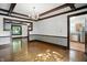 Dining room with hardwood floors, decorative trim, chandelier, and view into the kitchen at 39 N Bosart N Ave, Indianapolis, IN 46201