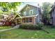 Charming home featuring a brick-and-siding facade with inviting front porch and manicured lawn at 39 N Bosart N Ave, Indianapolis, IN 46201