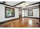 Bright living room featuring hardwood floors, decorative trim and ceiling beams at 39 N Bosart N Ave, Indianapolis, IN 46201