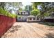Large backyard with a wood privacy fence, shed and home at 402 N Oxford St, Indianapolis, IN 46201