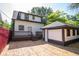 The backyard with a wood privacy fence, shed and access to the deck and back door of the home at 402 N Oxford St, Indianapolis, IN 46201