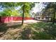 View of backyard and neighboring homes with wood privacy fence at 402 N Oxford St, Indianapolis, IN 46201