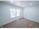 Empty bedroom with two windows and neutral carpeting at 402 N Oxford St, Indianapolis, IN 46201