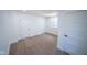 Well-lit bedroom with neutral carpeting and fresh white trim around the baseboard and doorframes at 402 N Oxford St, Indianapolis, IN 46201