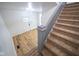 Entryway showcases wood-look floors and staircase leading upstairs at 402 N Oxford St, Indianapolis, IN 46201