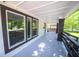 Open-air porch with brick pillars, fresh paint, and lots of natural light at 402 N Oxford St, Indianapolis, IN 46201