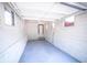 Interior view of the detached single car garage with windows and entry door at 402 N Oxford St, Indianapolis, IN 46201