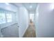 Hallway shot features bathroom and bedroom entries with natural lighting and neutral colors at 402 N Oxford St, Indianapolis, IN 46201