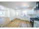 Bright kitchen features white cabinets, stainless steel appliances, and sleek countertops at 402 N Oxford St, Indianapolis, IN 46201