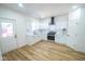 Modern kitchen with white cabinets, stainless steel appliances, and hardwood floors at 402 N Oxford St, Indianapolis, IN 46201
