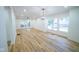 Open living room with hardwood floors and large windows at 402 N Oxford St, Indianapolis, IN 46201