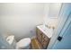 Powder room with wood vanity, modern fixtures, and decor at 402 N Oxford St, Indianapolis, IN 46201