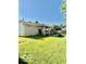 Backyard showcasing a covered patio and a well-manicured lawn at 409 N Kyle St, Edinburgh, IN 46124