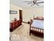 Bedroom with a four-poster bed, a large dresser, and neutral carpeting at 409 N Kyle St, Edinburgh, IN 46124