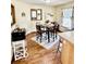 Cozy dining area with a square table, four chairs, and natural light from the window at 409 N Kyle St, Edinburgh, IN 46124