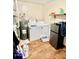 Functional laundry room with a washer, dryer, and a small freezer at 409 N Kyle St, Edinburgh, IN 46124