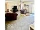 Spacious living room featuring plush carpeting and comfortable seating at 409 N Kyle St, Edinburgh, IN 46124