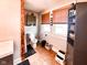 Cozy bathroom features a toilet, window, shelving and dark wood accent post at 430 W Locust St, Shelbyville, IN 46176