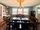 Cozy dining room featuring a rustic wood accent wall and a vintage piano at 430 W Locust St, Shelbyville, IN 46176