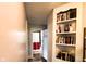 Hallway with built-in bookcase leads to the bathroom at 430 W Locust St, Shelbyville, IN 46176