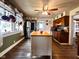 Bright kitchen with a central island, stainless steel appliances, and hardwood floors at 430 W Locust St, Shelbyville, IN 46176