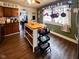Bright kitchen with wooden cabinets, central island, and lots of storage space at 430 W Locust St, Shelbyville, IN 46176