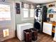 A laundry room with modern washer and dryer and a utility sink at 430 W Locust St, Shelbyville, IN 46176