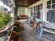 Cozy covered porch with rocking chairs and a swing at 430 W Locust St, Shelbyville, IN 46176