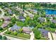 Breathtaking aerial view showcasing the neighborhood's lovely homes, pools, and mature trees near the lake at 4704 Pearcrest Way, Greenwood, IN 46143