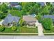 Overhead shot of a landscaped property with a well-maintained lawn and inviting swimming pool at 4704 Pearcrest Way, Greenwood, IN 46143