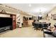Expansive finished basement with multiple entertainment areas, including a bar and game tables at 4704 Pearcrest Way, Greenwood, IN 46143
