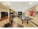 Spacious finished basement featuring a game room and a bar area at 4704 Pearcrest Way, Greenwood, IN 46143