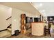Finished basement bar area with custom barrel accents and staircase access at 4704 Pearcrest Way, Greenwood, IN 46143