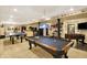 Basement recreation room with pool table, ping pong table, and a custom bar setup at 4704 Pearcrest Way, Greenwood, IN 46143