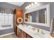 Bathroom with dual sinks, nautical themed decor and a large framed mirror above the sink at 4704 Pearcrest Way, Greenwood, IN 46143