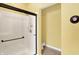 Modern bathroom featuring a glass enclosed shower, toilet, and neutral tile flooring at 4704 Pearcrest Way, Greenwood, IN 46143