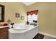Bright bathroom features a soaking tub and natural light at 4704 Pearcrest Way, Greenwood, IN 46143