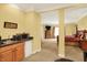 Spacious bedroom with a kitchenette, carpeted floor, and ample natural light at 4704 Pearcrest Way, Greenwood, IN 46143