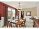 Elegant dining room featuring a classic chandelier, a wooden table, and a traditional decor at 4704 Pearcrest Way, Greenwood, IN 46143