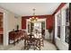 Bright dining room with natural light, a wooden table, and a view through large windows at 4704 Pearcrest Way, Greenwood, IN 46143